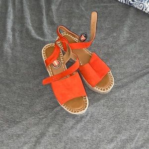 Orange platform heels.